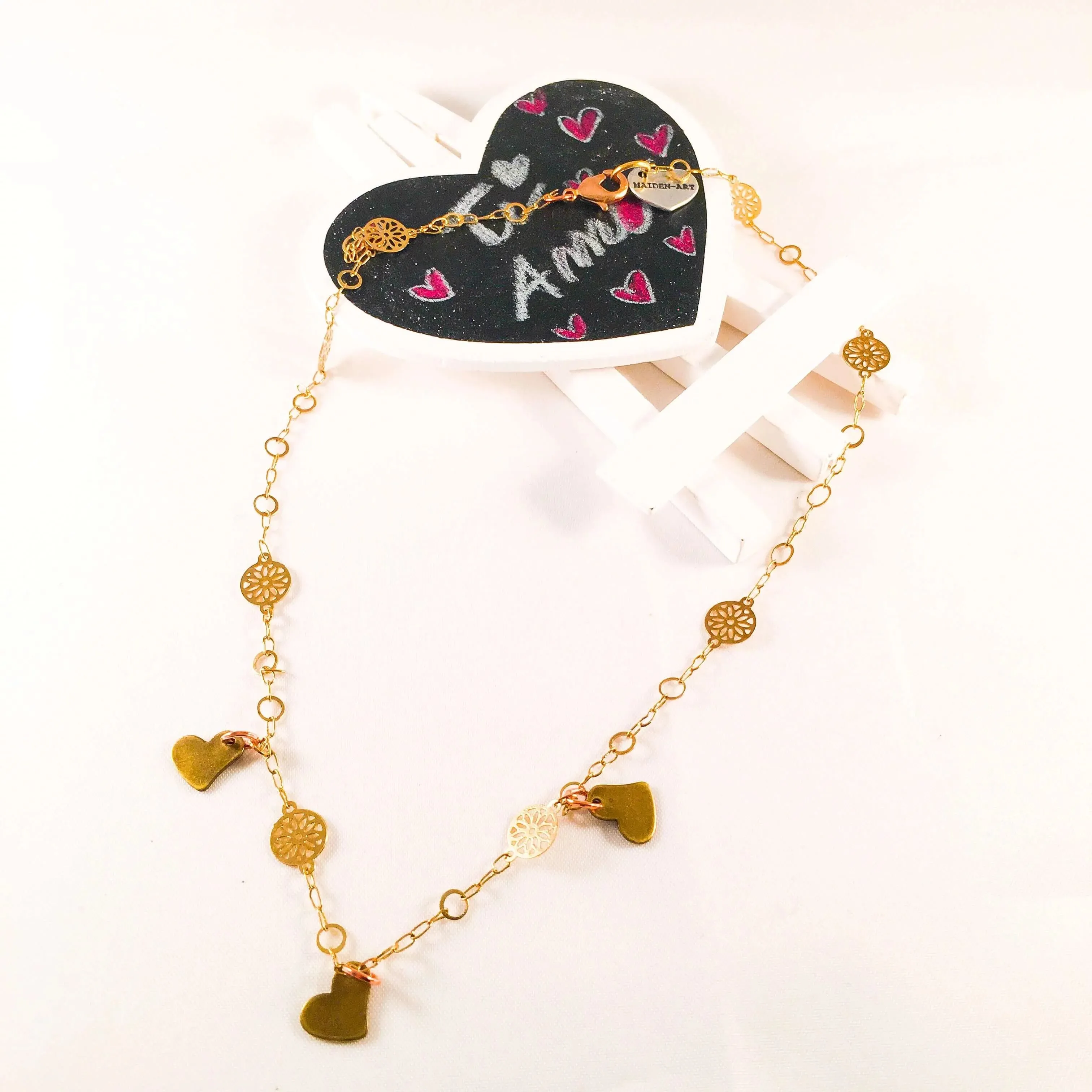 Triple Bronze Heart Charms Necklace with 18kt Gold Plated Flower Chain.